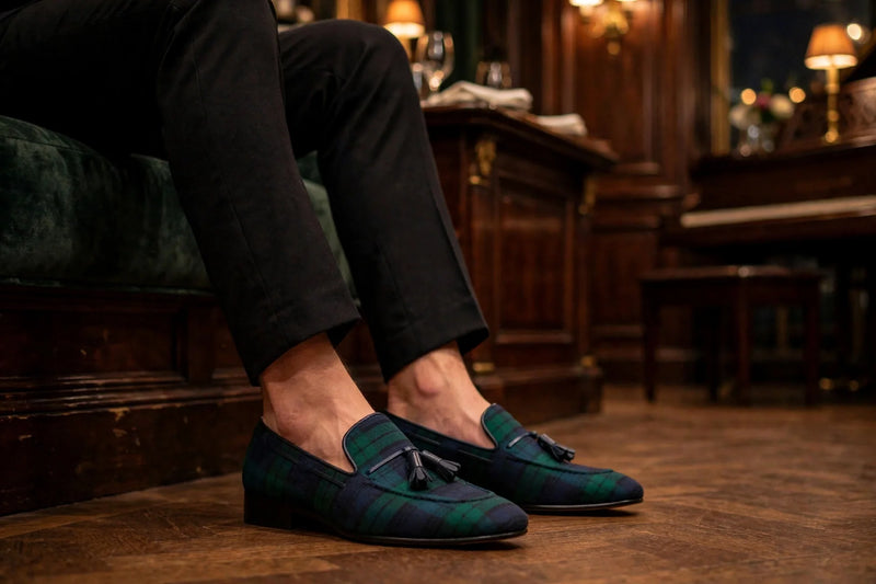 Blackwatch tartan tassel slippers worn in an Upper East Side piano bar