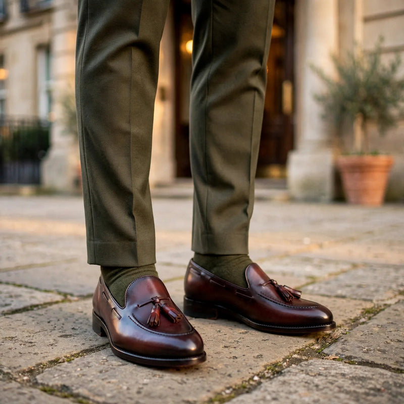 Burgundy box calf tassel loafers with an olive suit